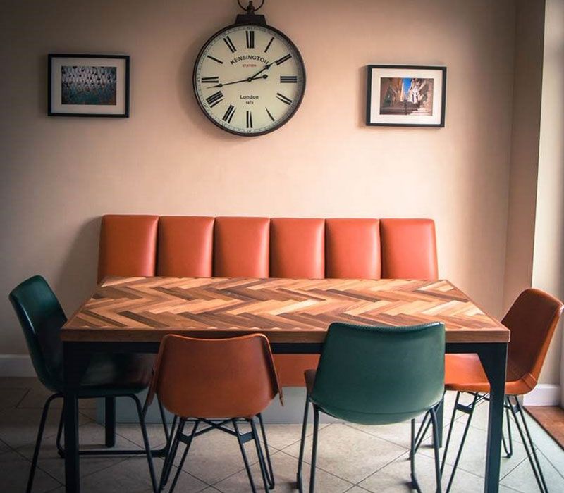 upholstered bench seating with dining table and chairs